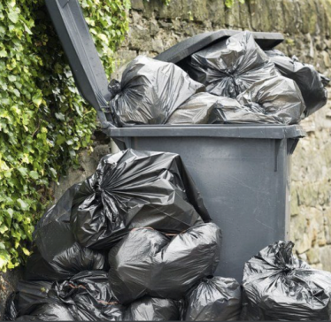 Bath recycling bin overflowing